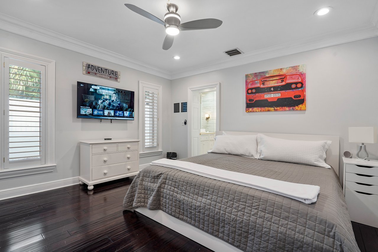 The fourth bedroom features a king size bed and a Smart TV.