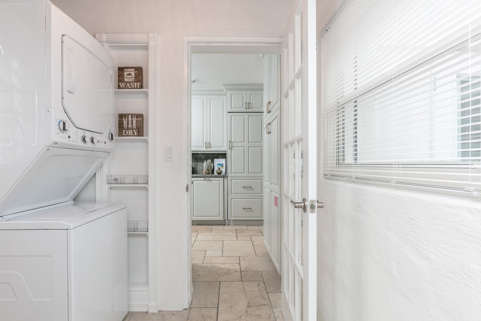 Hidden away next to the kitchen is the laundry room, with a washer/dryer combo