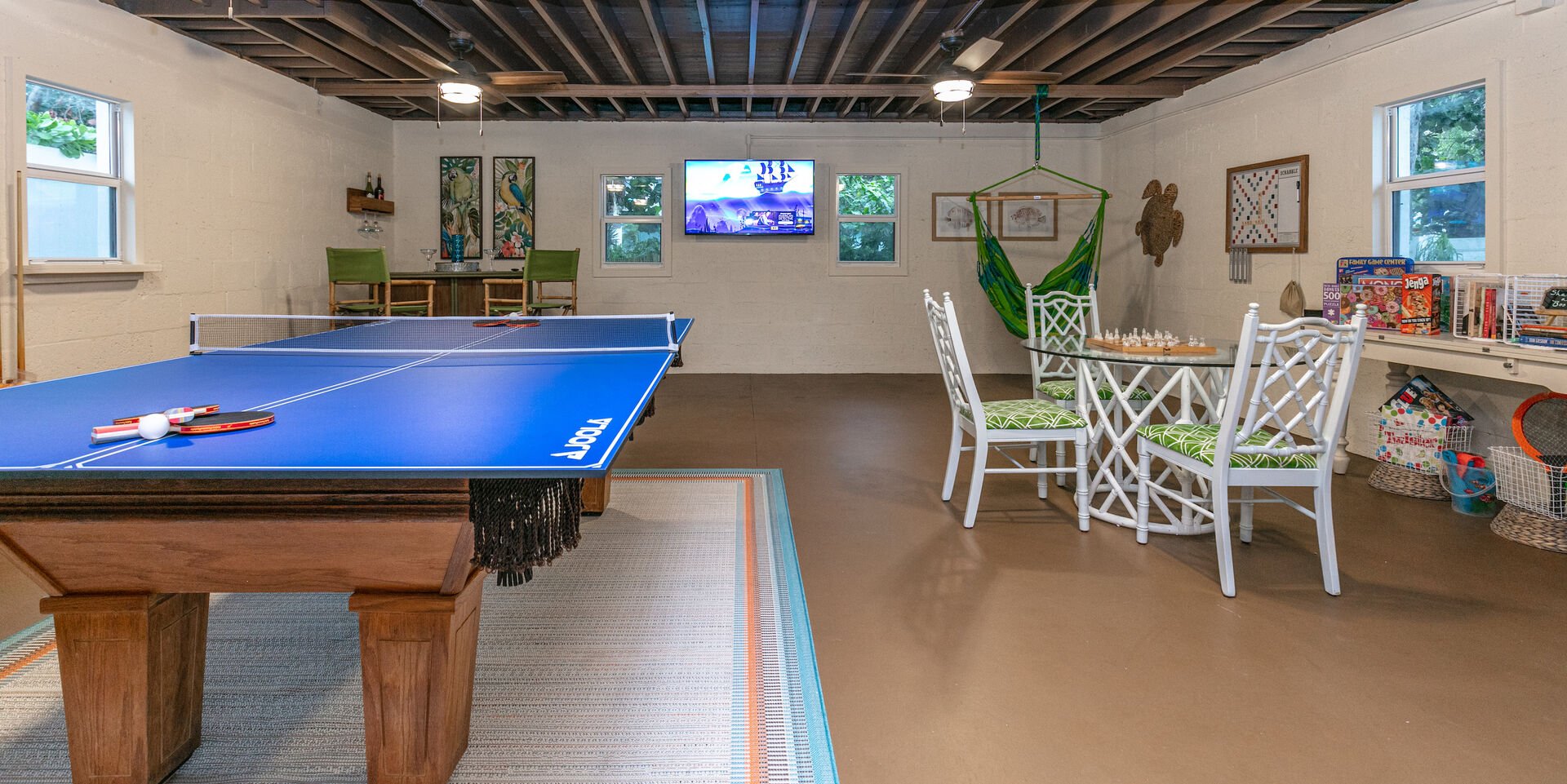 Game room includes a ping-pong table, a pool table, Smart TV, a mini bar, a board game area, and plenty of games to play!