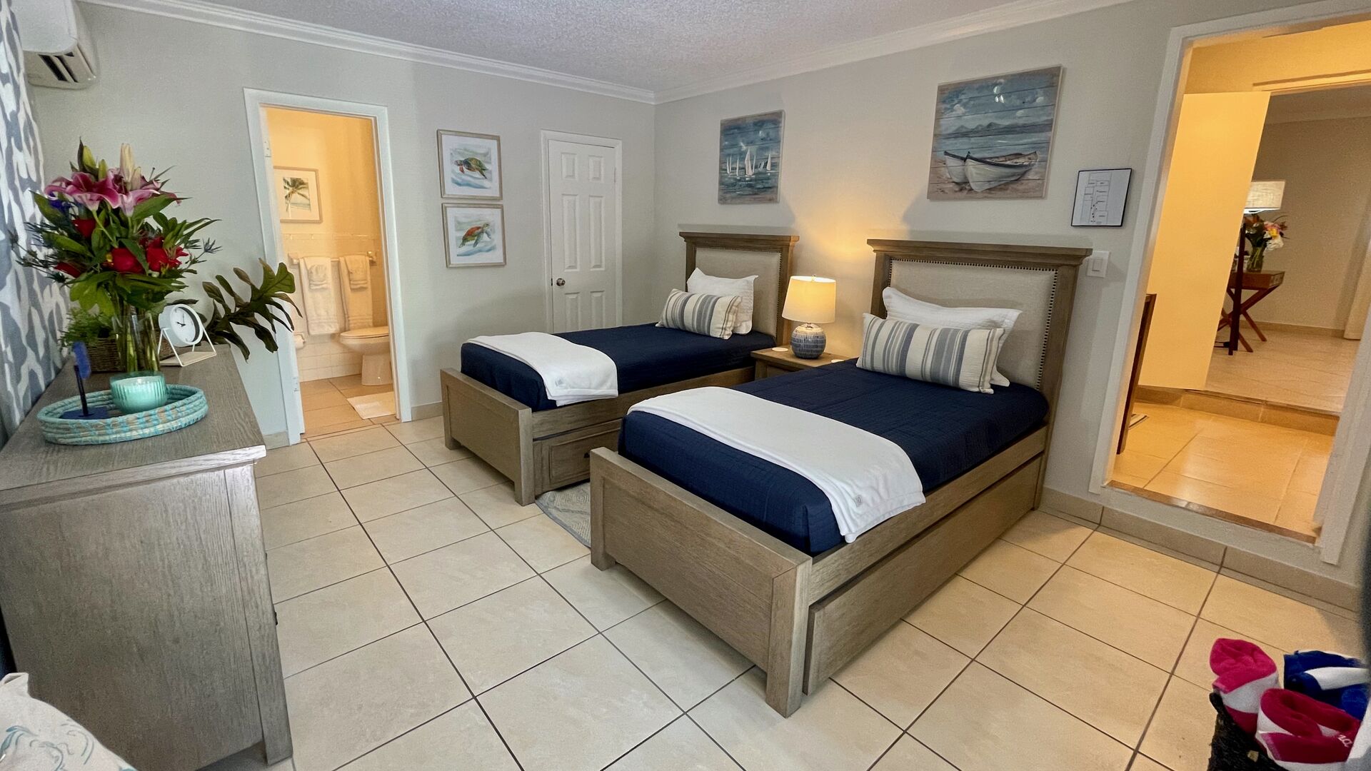The third bedroom features two twin-sized beds and a Smart TV, too. It also has access to its own full en suite bathroom!