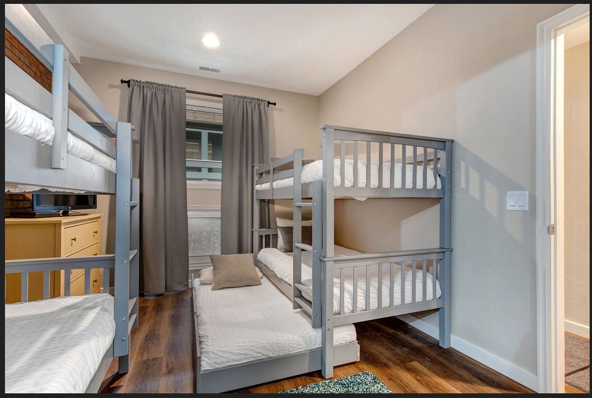 Bedroom 3 with two twin over twin bunkbeds and one trundle bed, 27