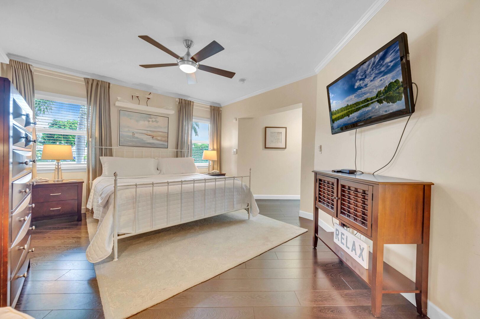 Spacious Master bedroom, featuring a king-sized bed and a wall-mounted Smart TV.
