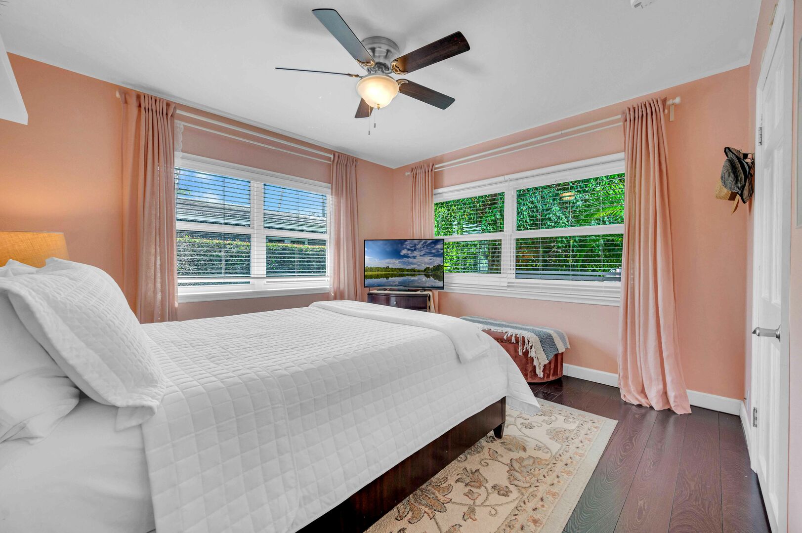 The third bedroom features a queen-sized bed and a Smart TV.