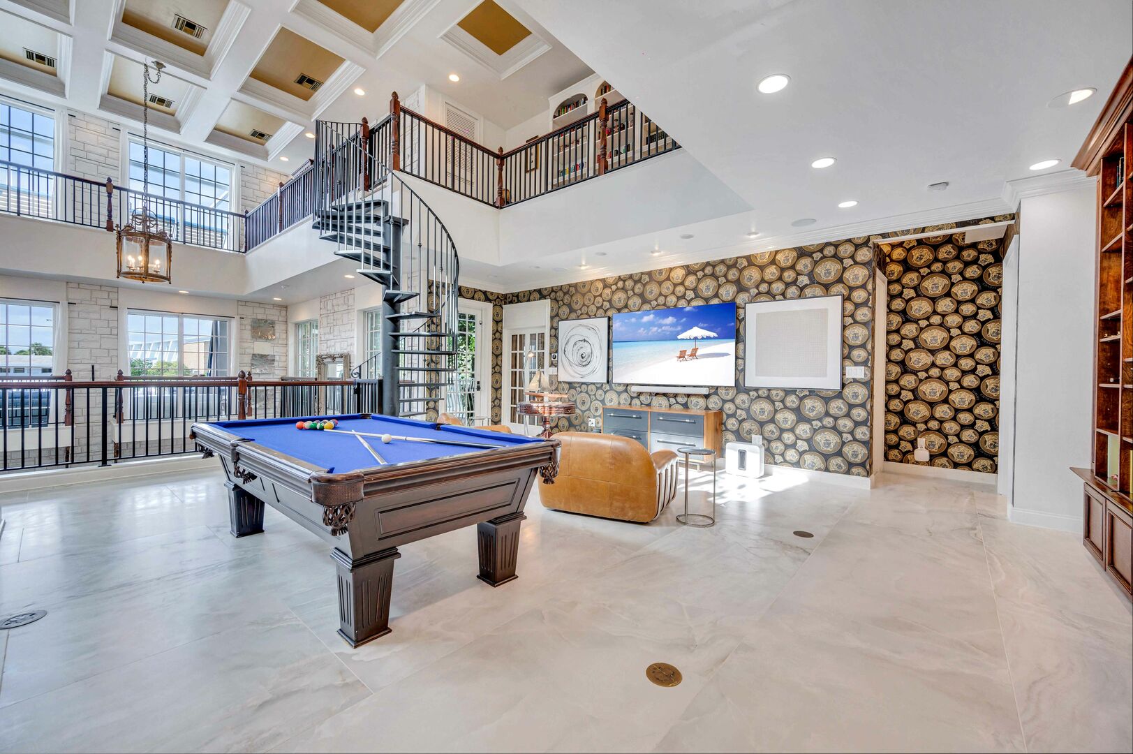 The second floor features a pool table, Smart TV, Sonos system and piano that can connect to it.