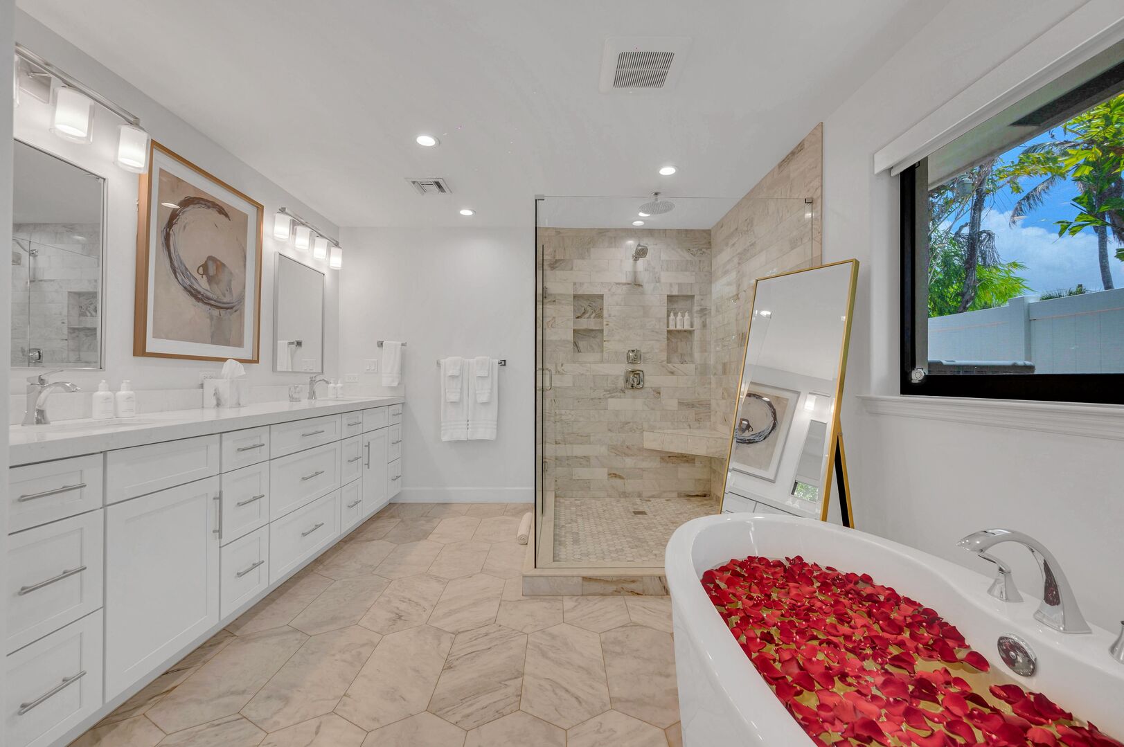 The master bathroom is spacious & updated. It includes a Soaking Tub and Walk-in Shower
