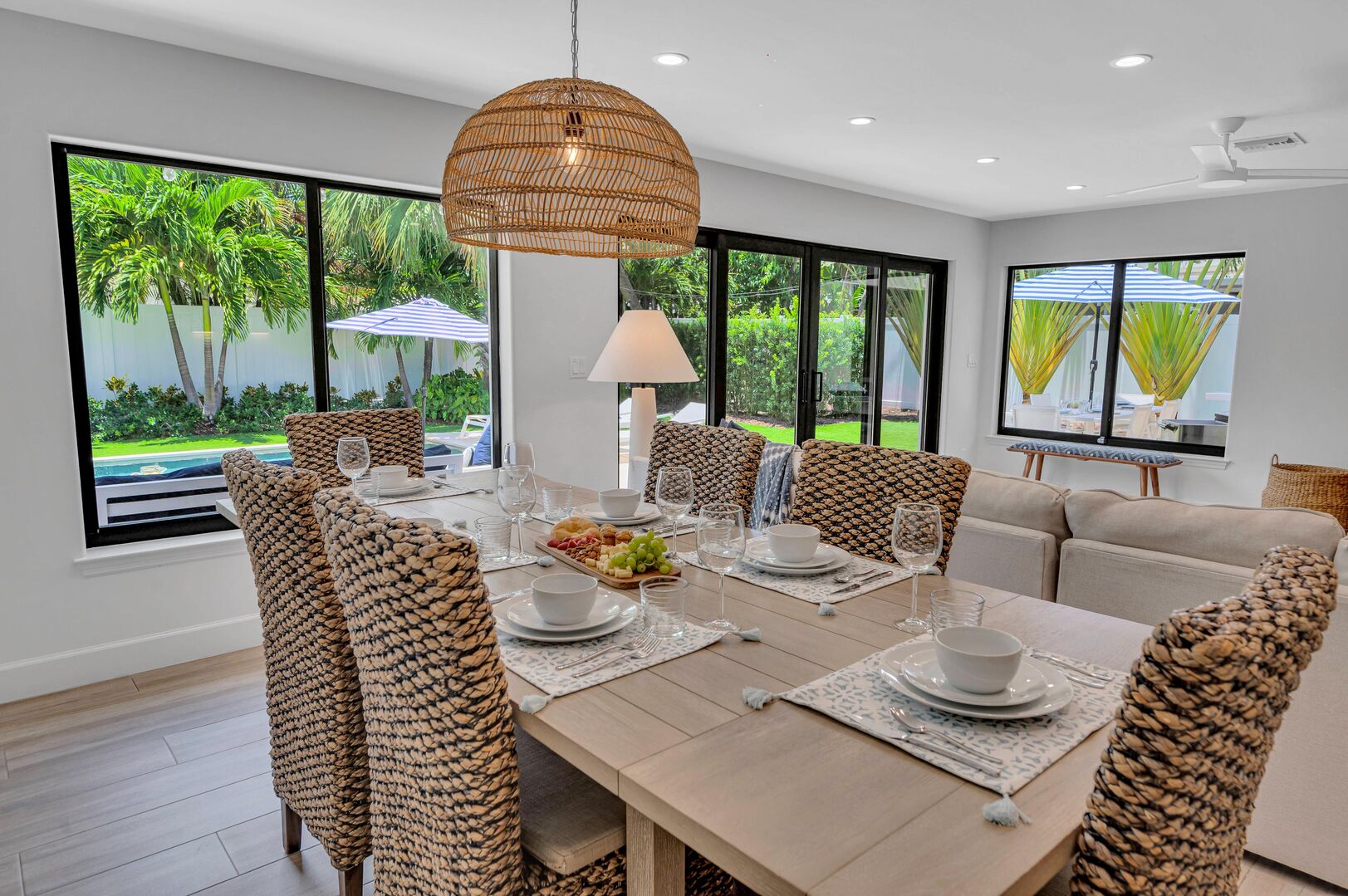 Dining table fit for eight overlooking the tropical garden which features a heated pool.