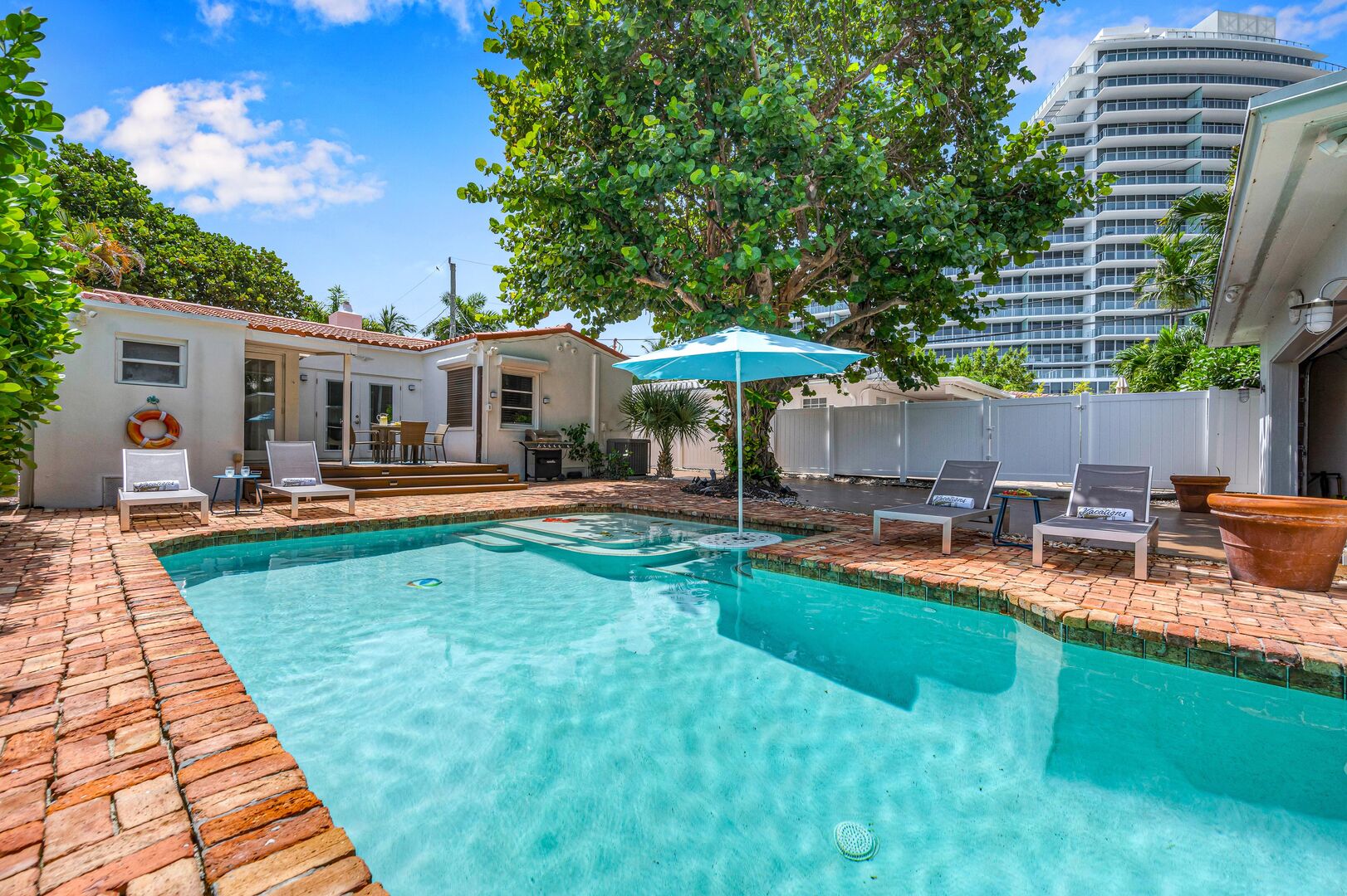 Outside, you will find the heated saltwater pool and plenty of chairs.