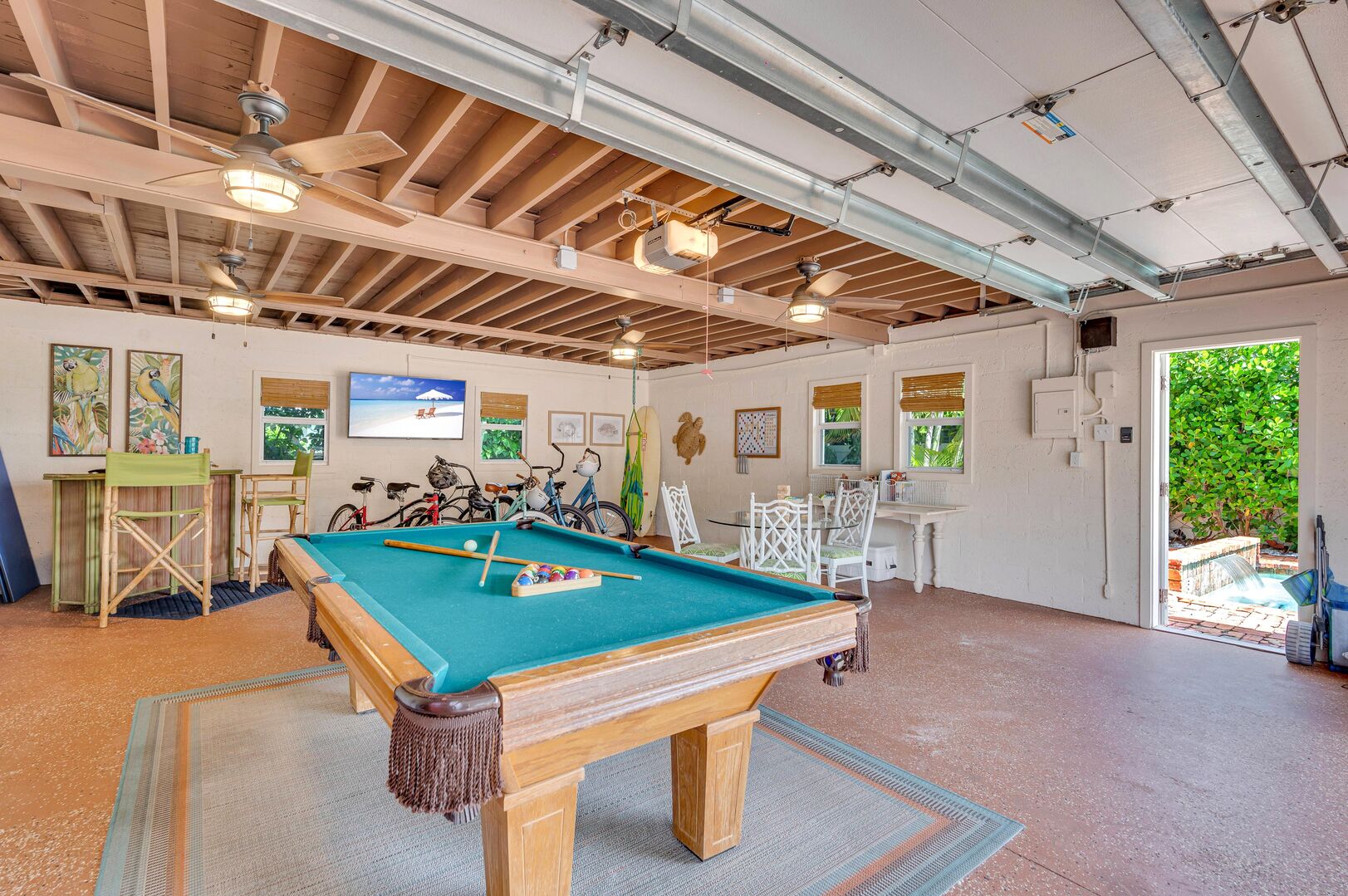 The game room features a ping-pong/pool table, seating and bar area.