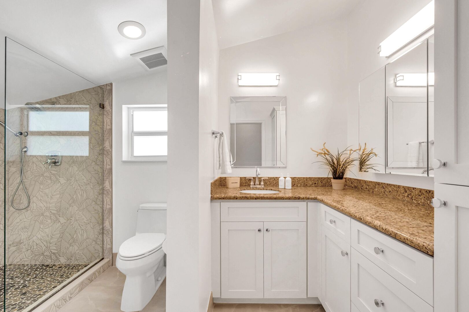 The upstairs bathroom features a walk-in shower.