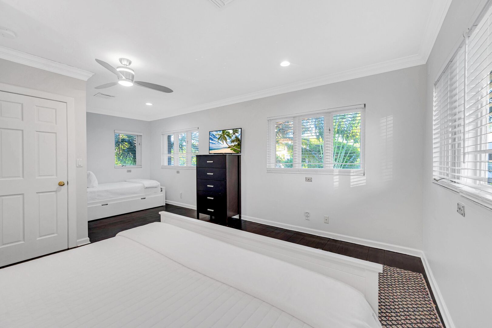Bedroom five features a queen size bed, a trundle bed and a Smart TV.