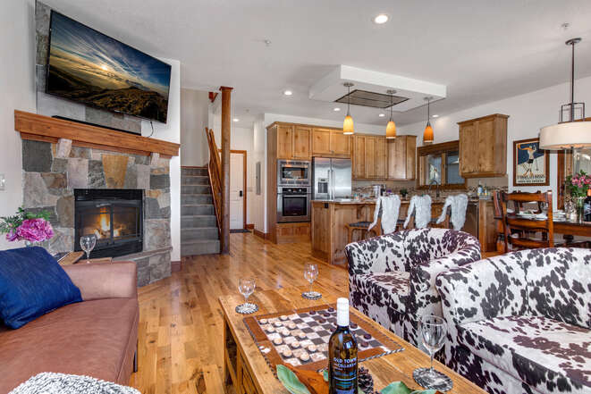 Main Level Great Room with a Gas Fireplace and Hardwood Flooring