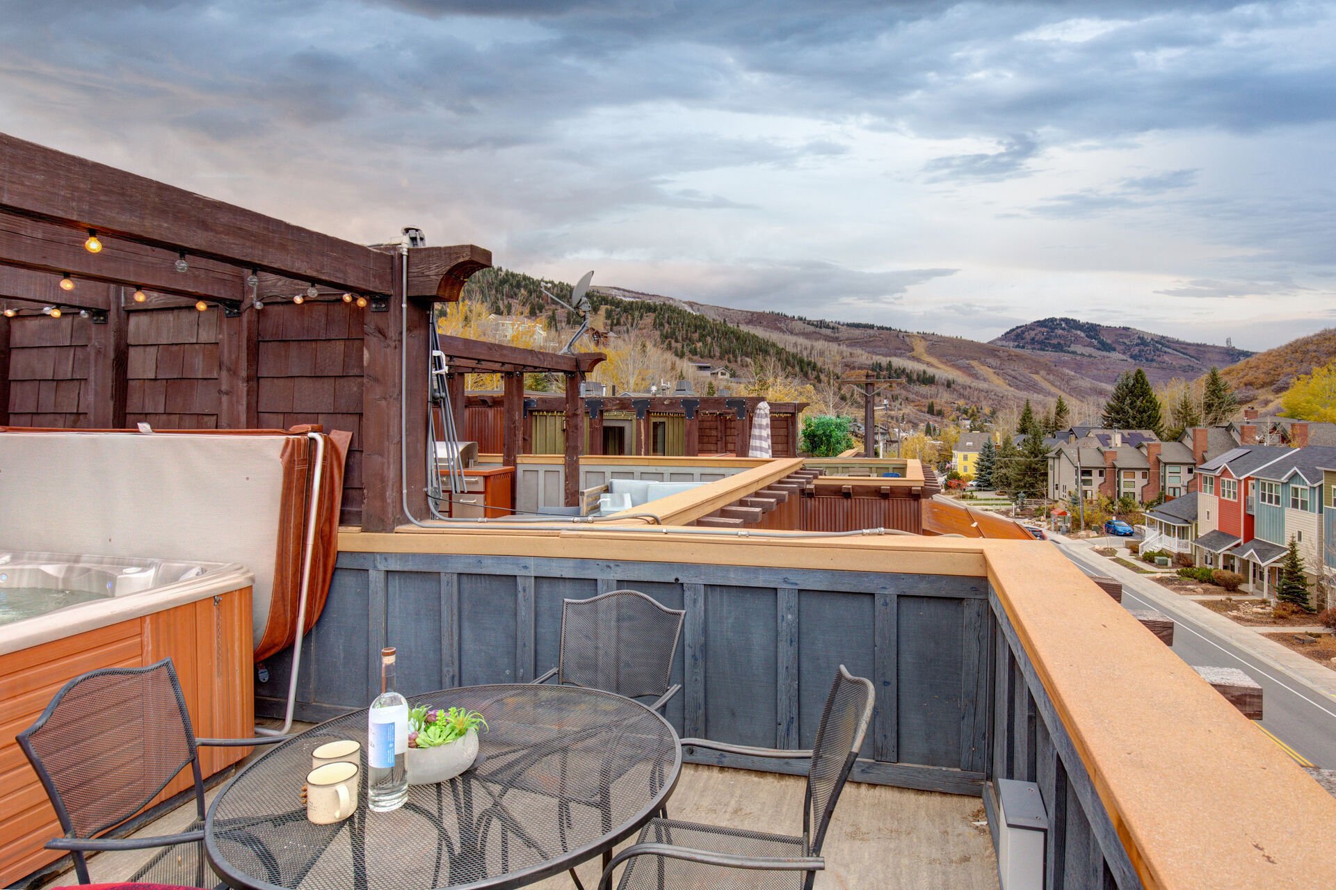 Private Roof Deck with Powder Room,  hot tub, two seating areas, outdoor fire-pit, BBQ, and stunning surrounding views of Park City