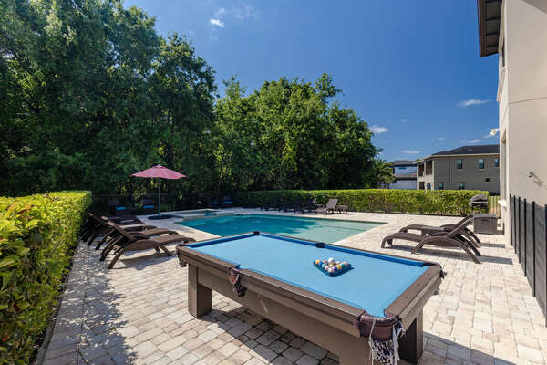 Play at this outdoor pool table before or after swimming