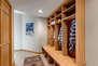 Garage Entryway Mudroom with locker-style cubbies, hooks, and storage