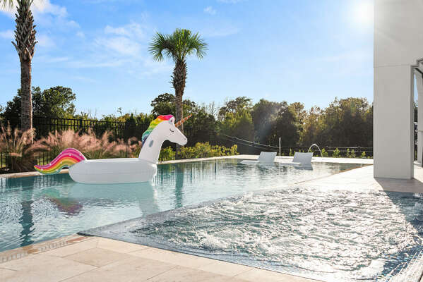 Infinity edge spa, ledge loungers, and inflatable an unicorn, what else on vacation do you need?
