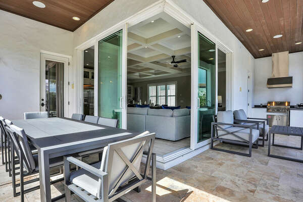 Take advantage of the summer kitchen with BBQ grill and dine alfresco at the outdoor dining table.