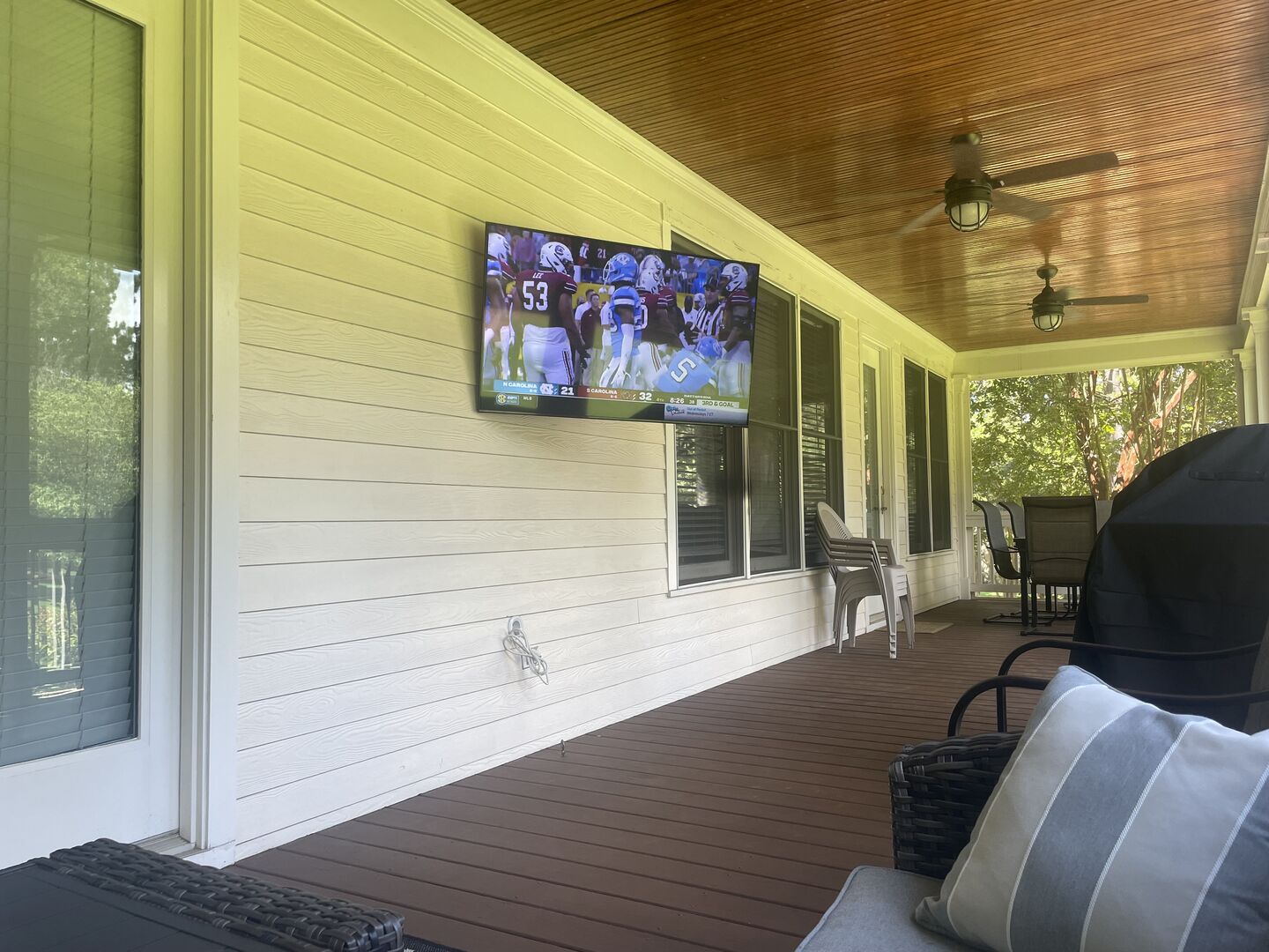 Screened porch complete with a new outdoor tv!