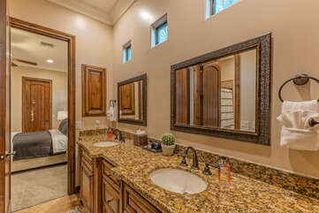 Bathroom 3 is situated between Bedrooms 4 and 5 and features dual vanity sinks, a tub-shower combo plus a separate shower.