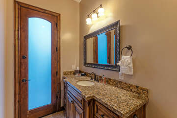 Bathroom 4 is a private bath for Bedroom 6 and has direct access to the pool area.