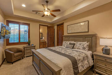 Beautiful Bedroom 6 has a king bed, ceiling fan, TV, walk-in closet and private en suite bath.