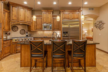 Contemporary kitchen has counter seating for 3.