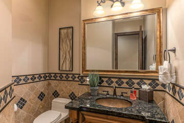 Bathroom 2 is a powder room conveniently located in the main hallway.