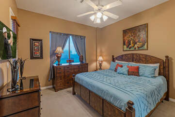 Bedroom 3 is on the ground floor and has a king bed, TV and ceiling fan.