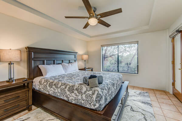 Master Bedroom with a California King Bed and Access to the Sun Room