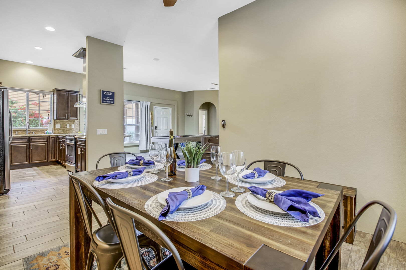 The casual dining area features a dining table with seating for six.