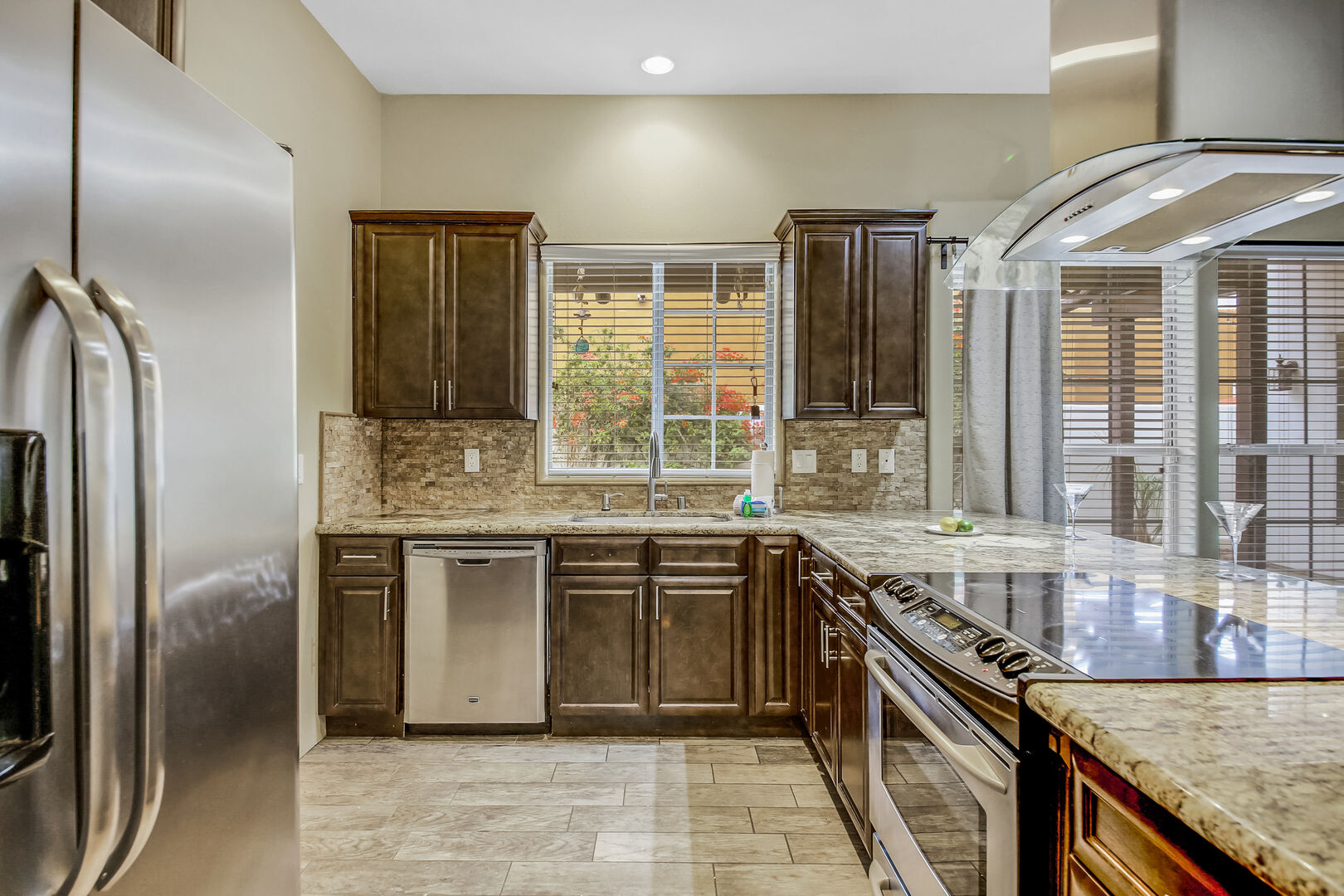 The fully-equipped kitchen features stunning stainless steel appliances.