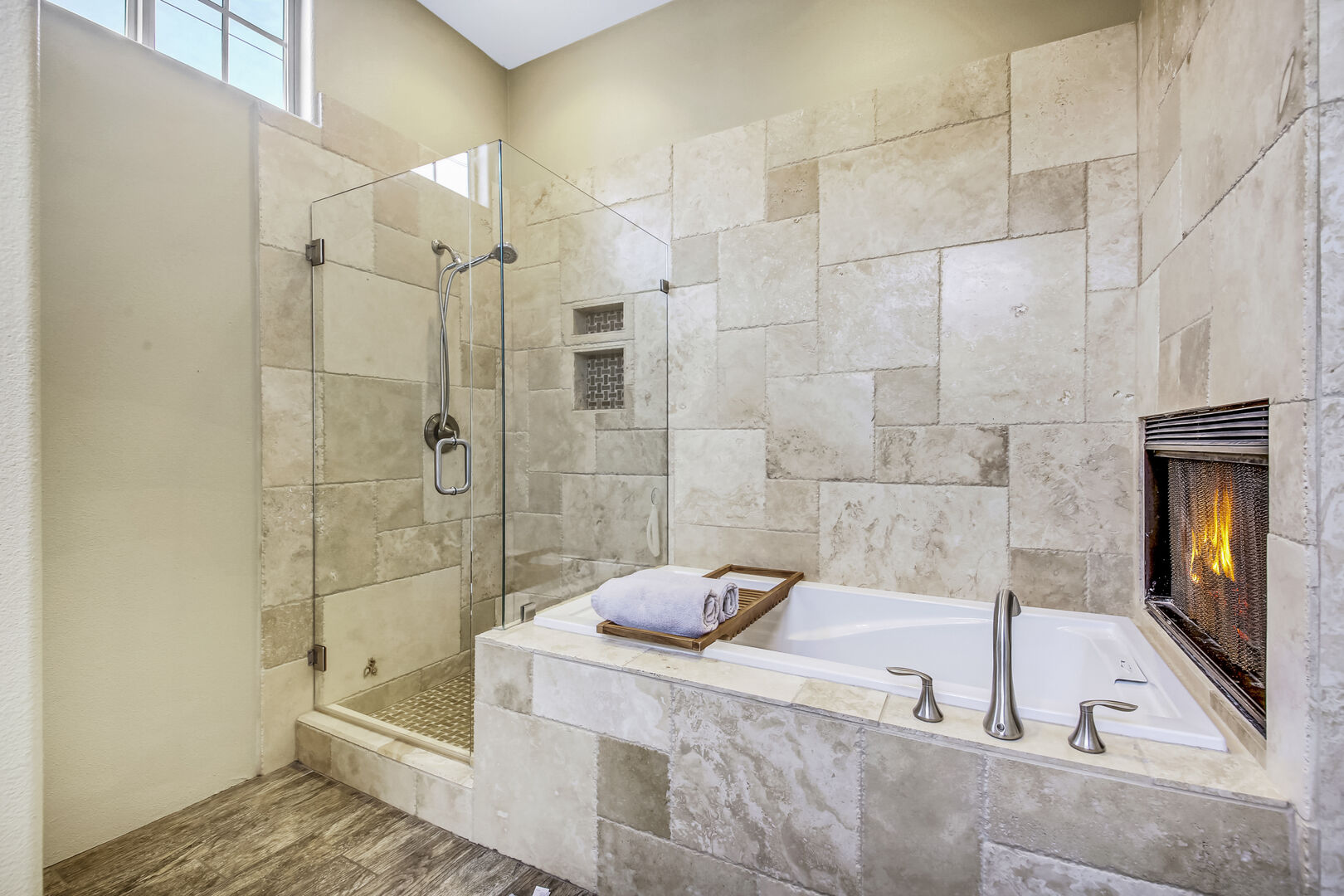 The private, en suite bathroom features a jacuzzi tub, tile shower.