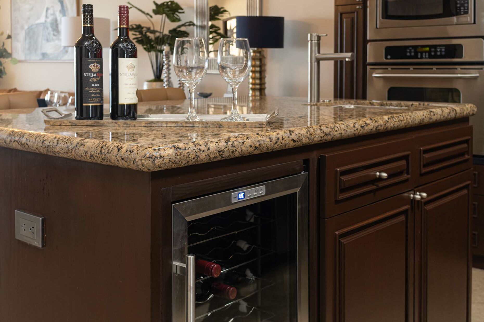 There is a wine refrigerator as part of the kitchen island.