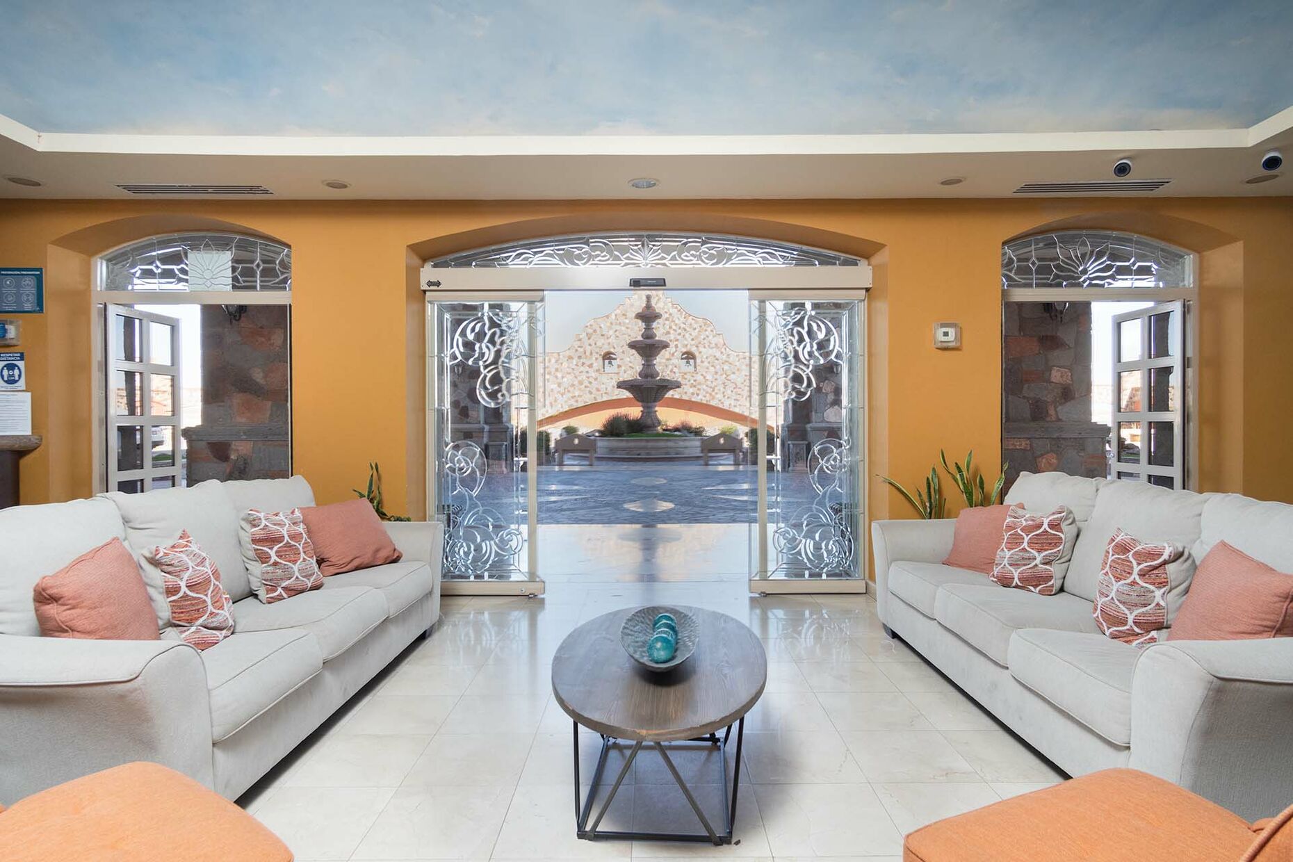 The lobby entrance reveals the elegant interior of the Sonoran Sky Resort.