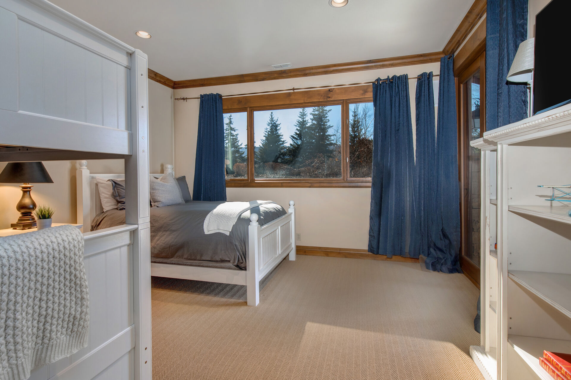 Lower Level Bedroom 4 with twin over twin bunkbeds, full bed, smart tv, and en suite bathroom