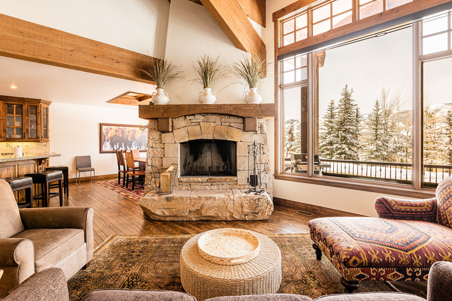 Main Level Living Room with vaulted ceilings, fireplace, and stunning views of the surrounding mountains