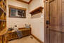 Garage Entryway Mud Room with equipment hooks, convenient bench and storage cubbies