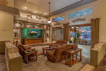 Gather in great room for watching large TV or supervising pool activities.
