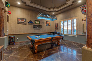 Stylish game room with pool table for friendly billiard games.