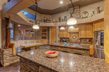 Designer kitchen includes built in table and island seating.
