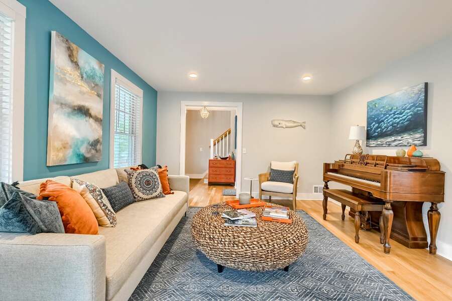 Living room with couch, piano and chair 129 Hardings Beach Rd Chatham-Cape Cod-New England Vacation Rentals