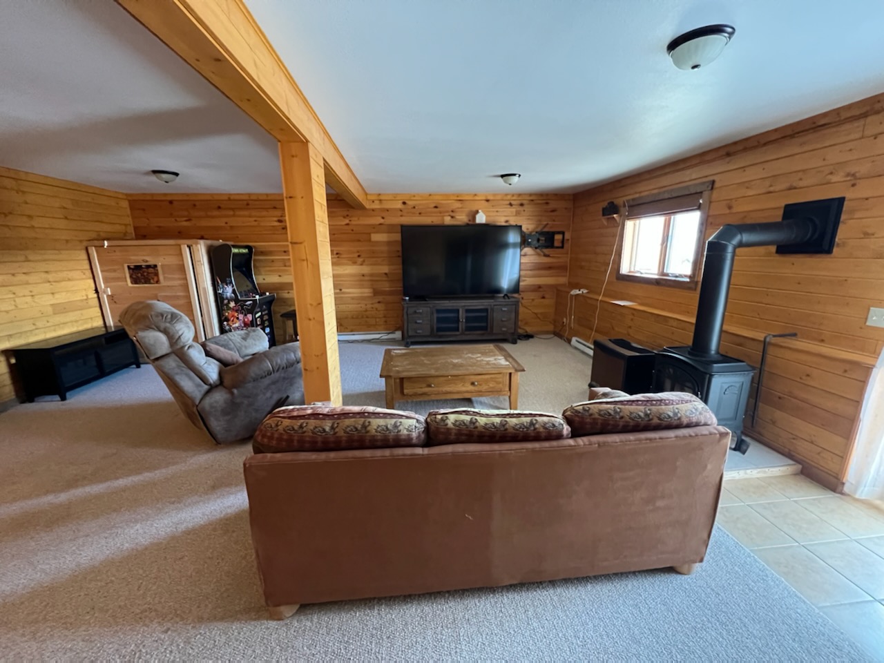 Lower Level Living Area with large Tv and fireplace