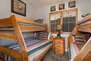 Bedroom 3 with 2 twin over full bunk beds and full bath access