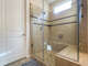 Detached and enclosed shower.