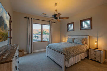 Bedroom 4 with a queen bed and smart TV shares a Jack & Jill bathroom with Bedroom 5.