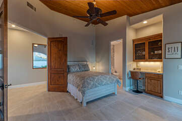Bedroom 3 features a queen bed, ensuite bath, smart TV, built-in desk, walk-in closet and fireplace.