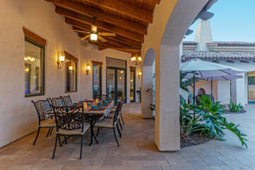 Outdoor dining at its best on the covered patio in the backyard. For cool evenings tower propane heaters have been added.