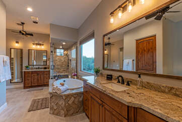 The ensuite primary bath includes a Jacuzzi garden tub, separate shower and dual vanity sinks.