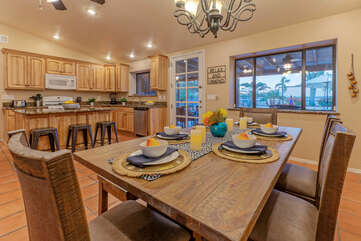 Serve casual or formal meals at the dining table with seating for 6.