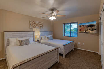 Expect comfort and sweet dreams in either of the queen beds in Bedroom 4.