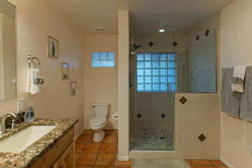 Dual sinks and walk-in shower are appealing features of the primary bathroom.